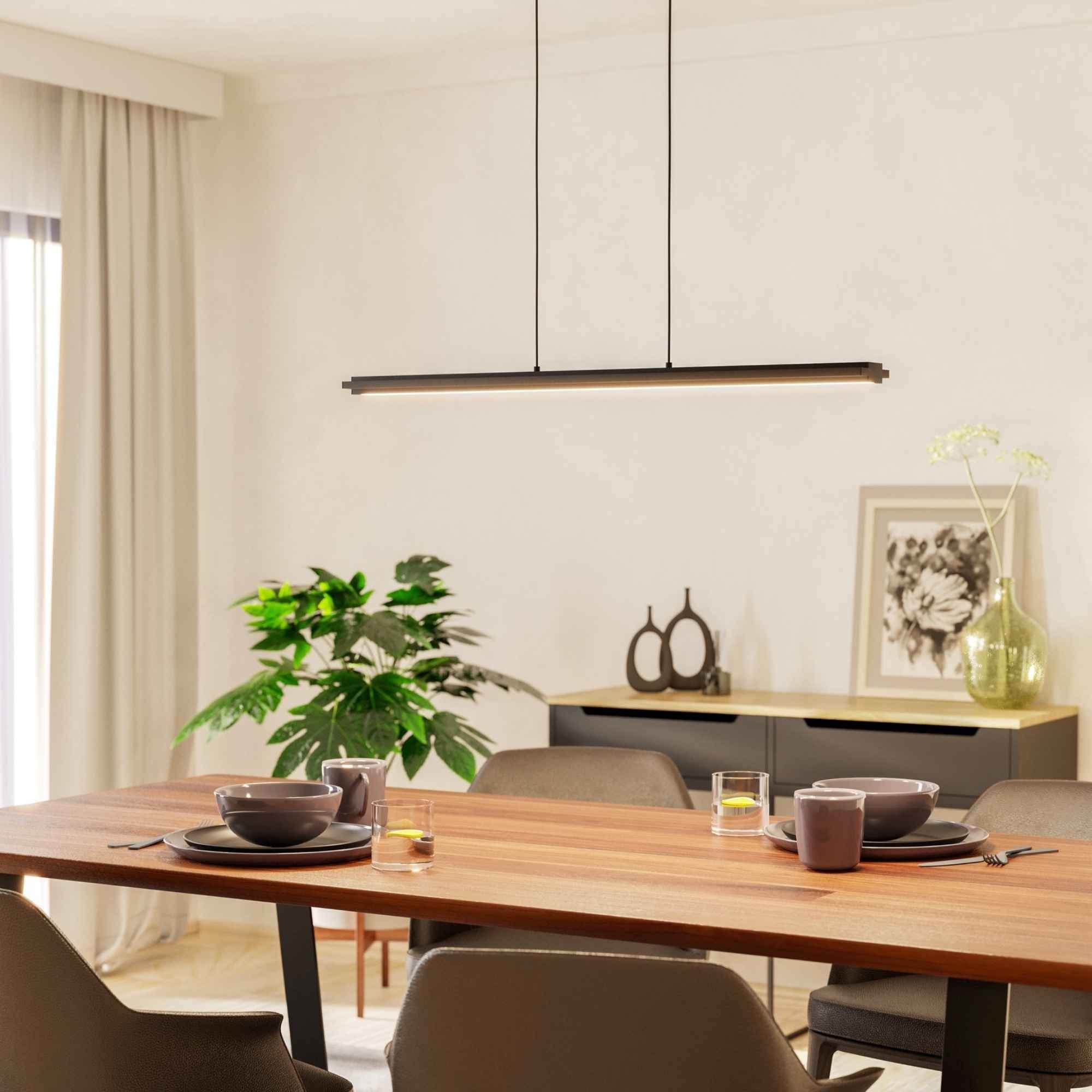 Lustra LED Cambulos Eglo 99599 în ambient modern, deasupra mesei, cu lumina aprinsă.