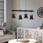 Lustra vintage Shirebrook Eglo 43726 este montată într-un interior industrial, unde cele patru abajururi negre oferă o iluminare uniformă și accent decorativ.