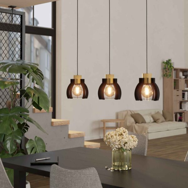 Lustra vintage Stillington 1 Eglo 43925 montată deasupra unei mese, integrată într-un interior modern cu accente industriale și lumina aprinsă.