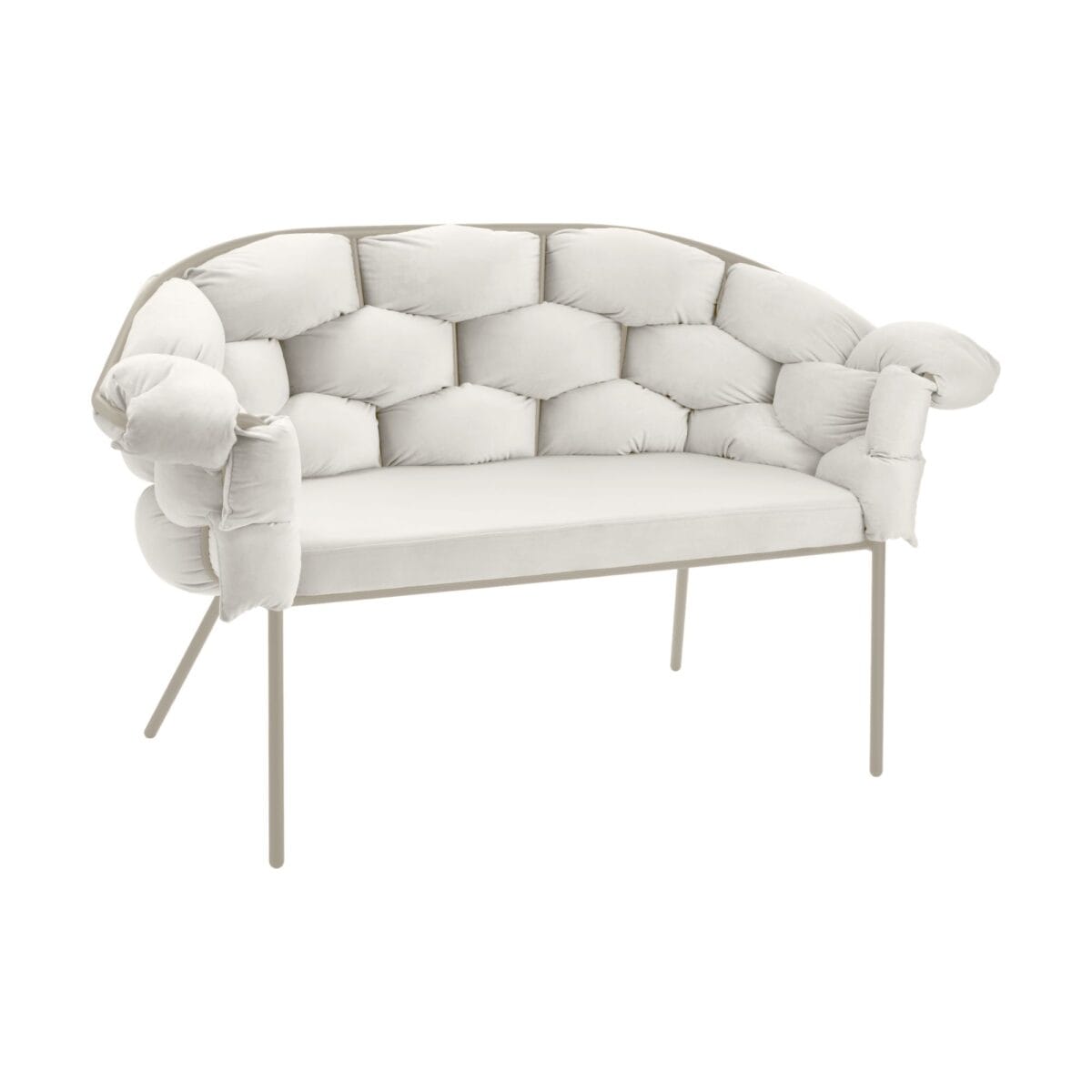 Curved cream tufted sofa with thick cushions and slim metal legs viewed from the front-right corner