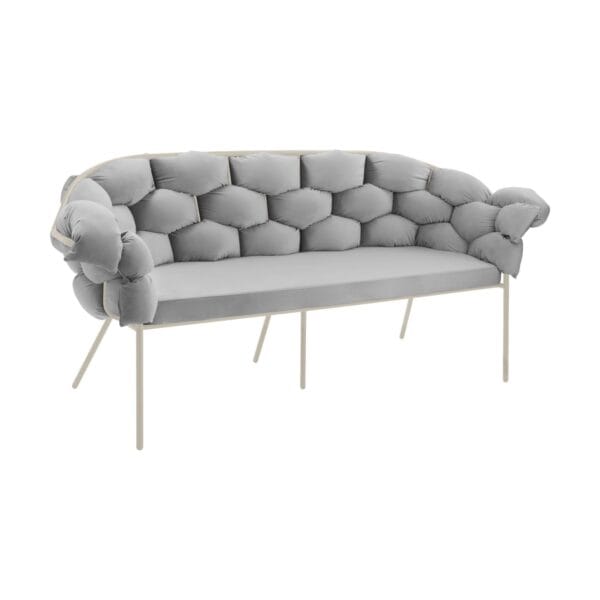 Gray tufted sofa with metal legs shown from the side against a white background, partial view of the piece