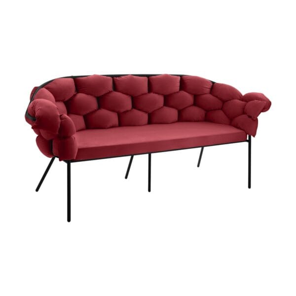 Red tufted sofa with a black metal frame and slim legs set against a white background (partial view)