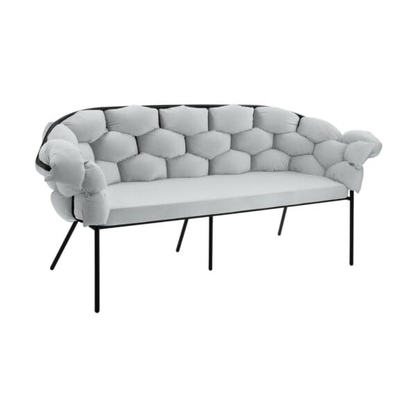 Curved light-gray tufted sofa with metal legs set against a white background, close-up view