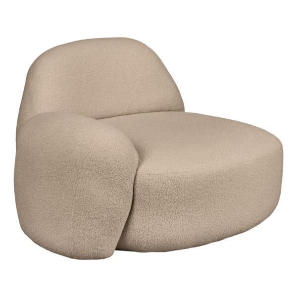 Beige foam cushions with rounded edges stacked against a white background, close-up view.