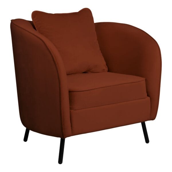Close-up of a rust-red upholstered armchair with curved arm and black angled legs, viewed from the side.